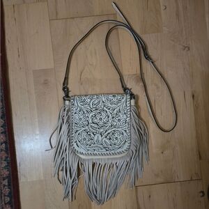 White tooled western fringe bag